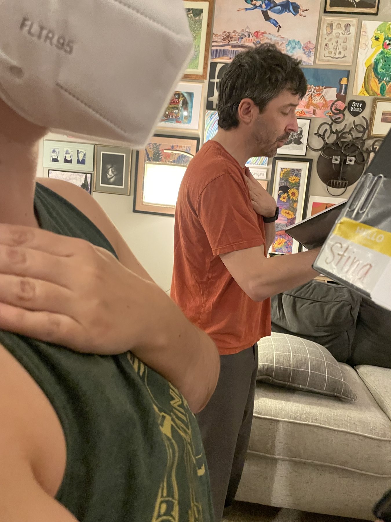 An ensemble member reads music during a casual gathering